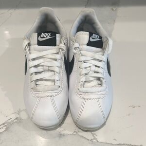 Nike White Sneakers with Classic Design and Large Swoosh Logo
